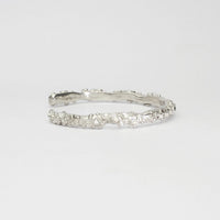 Rockpool silver torque bangle with sapphires by Emily Craig