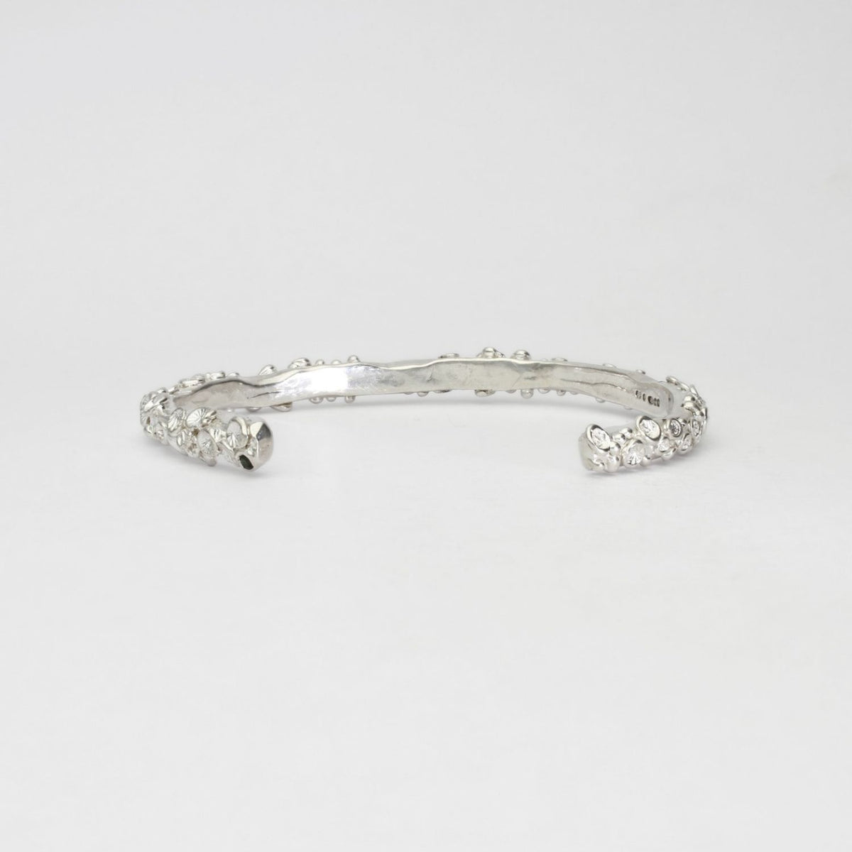 Rockpool silver torque bangle with sapphires by Emily Craig