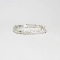 Rockpool silver torque bangle with sapphires by Emily Craig