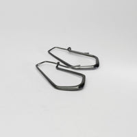 Short forged black silver hoop earrings by Emily Thatcher