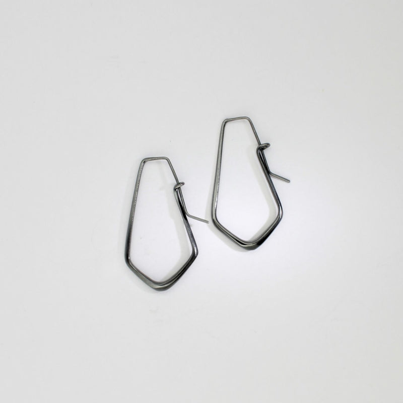 Short forged black silver hoop earrings by Emily Thatcher