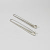 Long forged silver drop earrings by Emily Thatcher