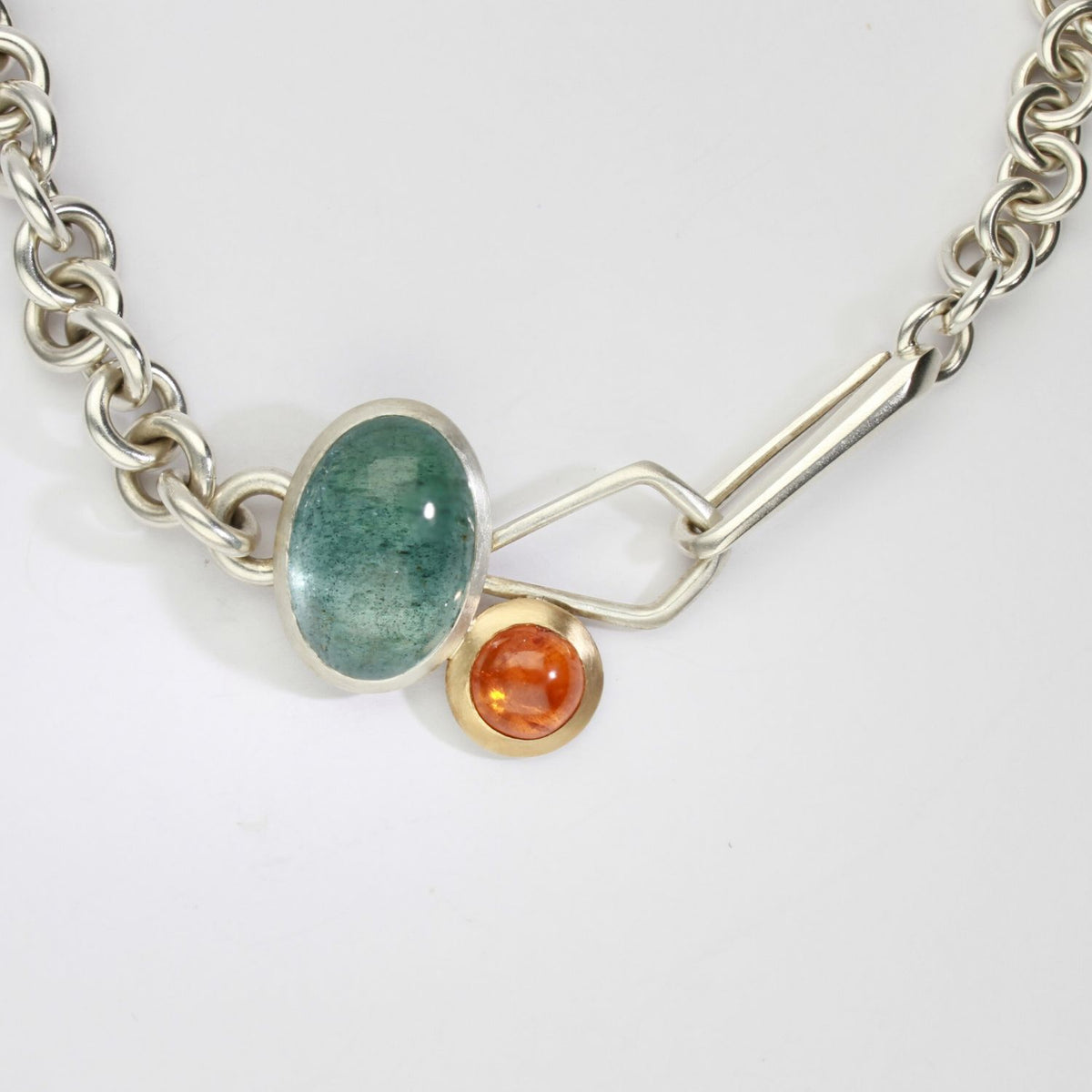 Camur heavy-weight necklace with aquamarine & mandarin garnet silver & 18ct gold by Emily Thatcher