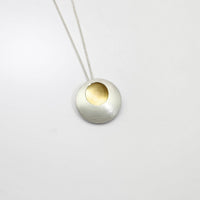Large pebble silver & gold plated pendant by Hannah Souter