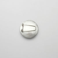 Pebble silver & gold plated brooch by Hannah Souter