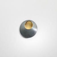 Pebble black silver & gold plated brooch by Hannah Souter