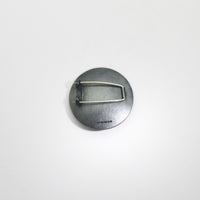 Pebble black silver & gold plated brooch by Hannah Souter