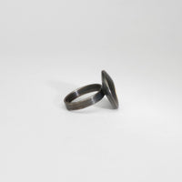 Small pebble black silver & gold plated ring by Hannah Souter