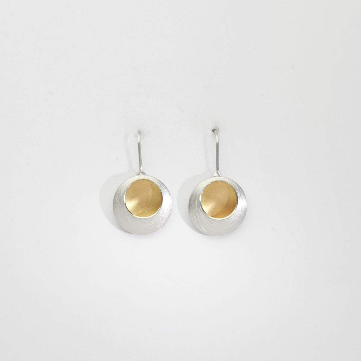 Pebble satin silver & gold plated drop earrings by Hannah Souter