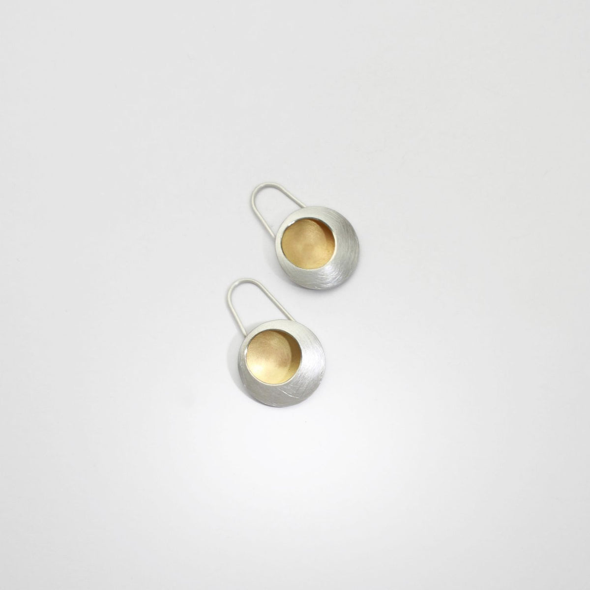 Pebble satin silver & gold plated drop earrings by Hannah Souter