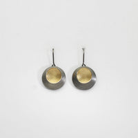 Pebble satin black silver & gold plated drop earrings by Hannah Souter