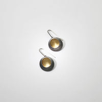 Pebble satin black silver & gold plated drop earrings by Hannah Souter