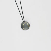 Small lunar 2 satin black silver & 18ct gold pendant by Hannah Souter