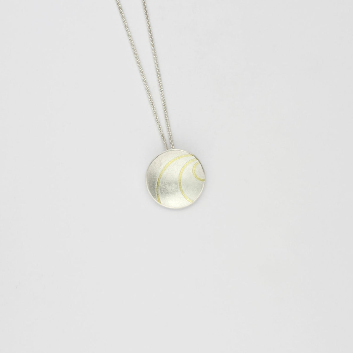 Small lunar 3 satin silver & 18ct gold pendant by Hannah Souter