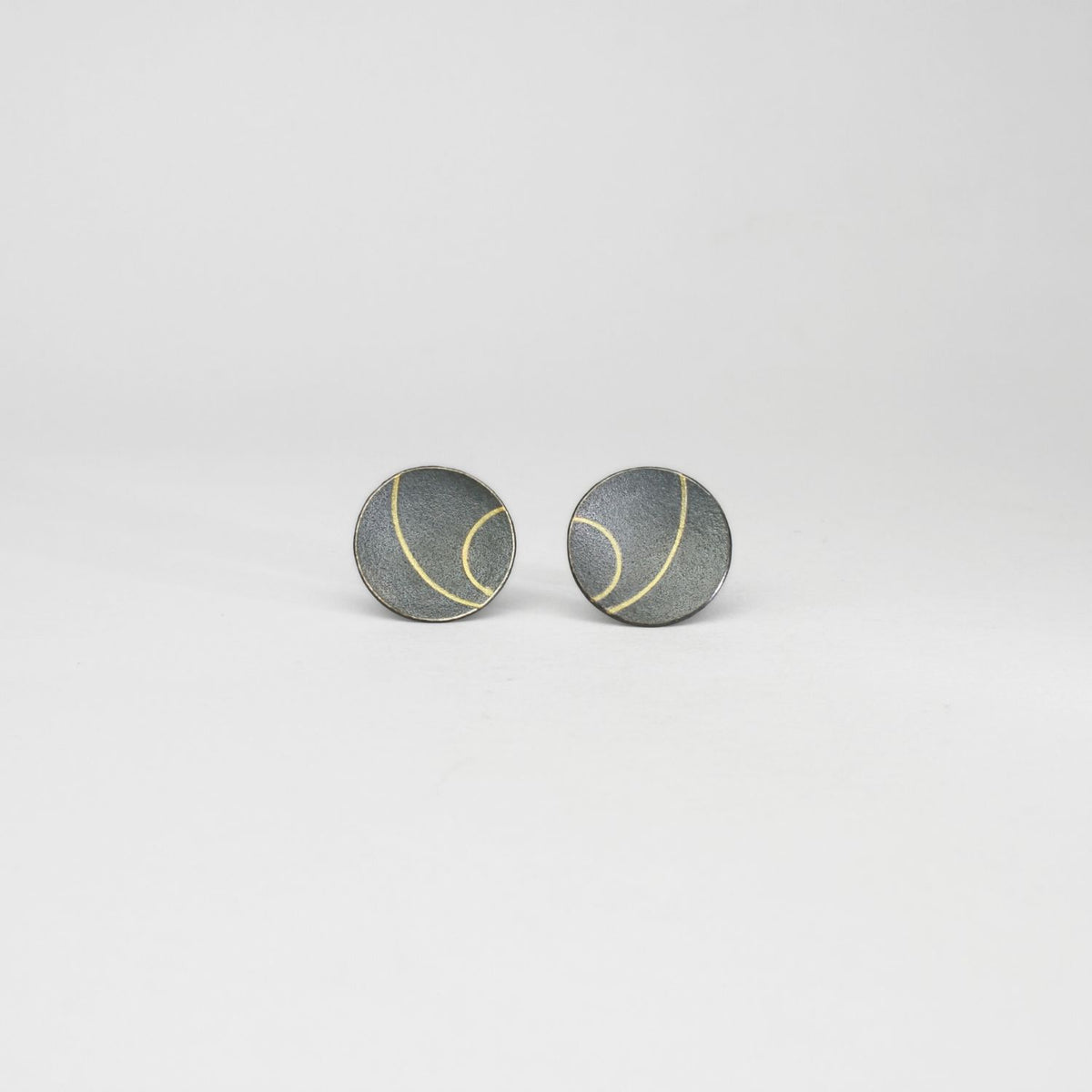 Large lunar 2 satin black silver & 18ct gold studs by Hannah Souter