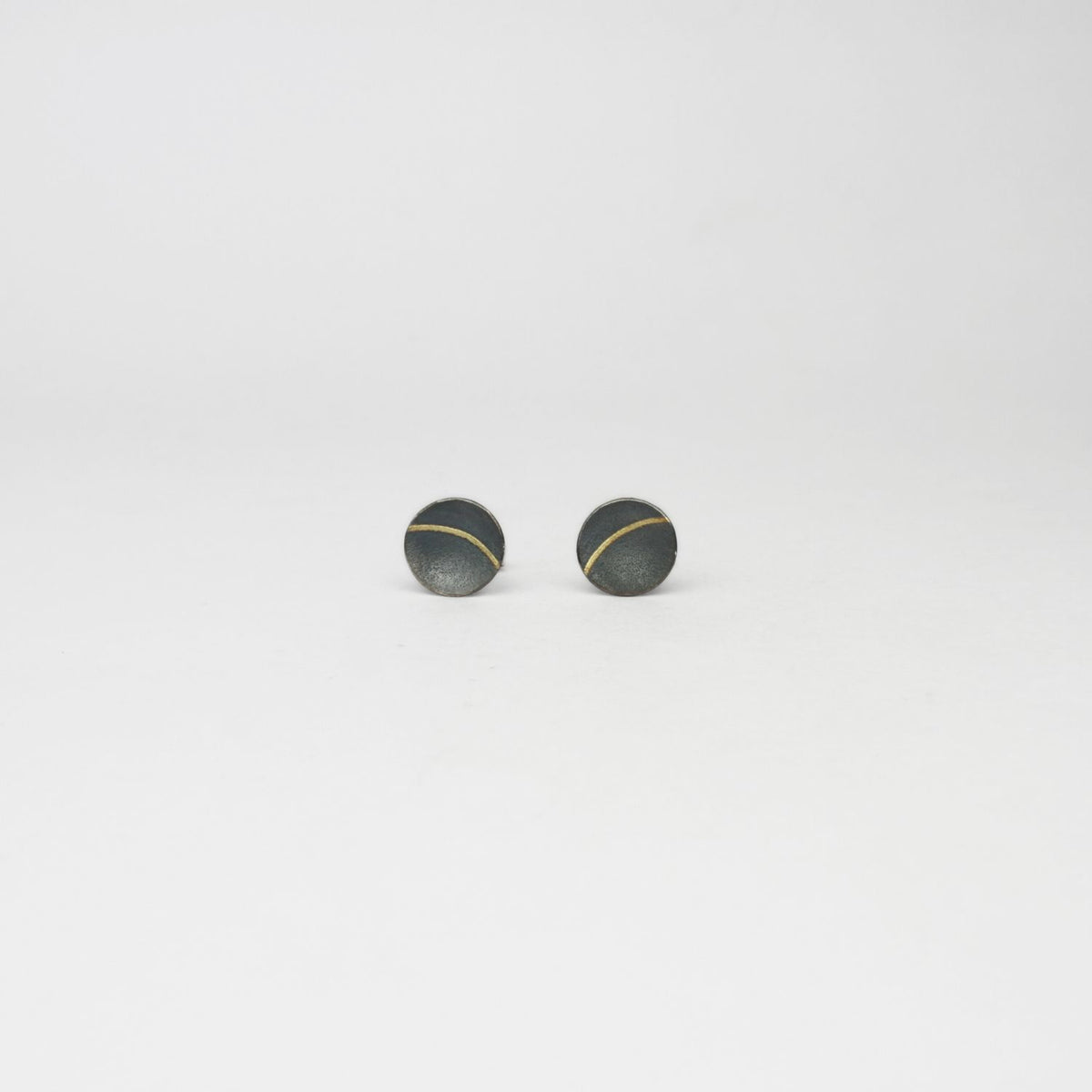 Small lunar 2 satin black silver & 18ct gold studs by Hannah Souter