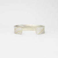 Lunar satin silver & 18ct gold cuff bangle by Hannah Souter