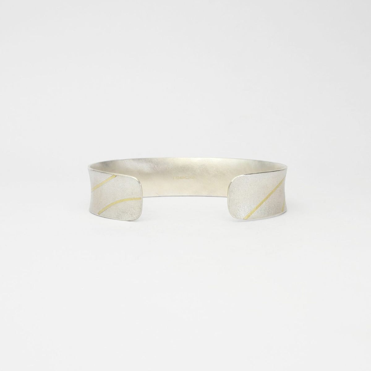Lunar satin silver & 18ct gold cuff bangle by Hannah Souter