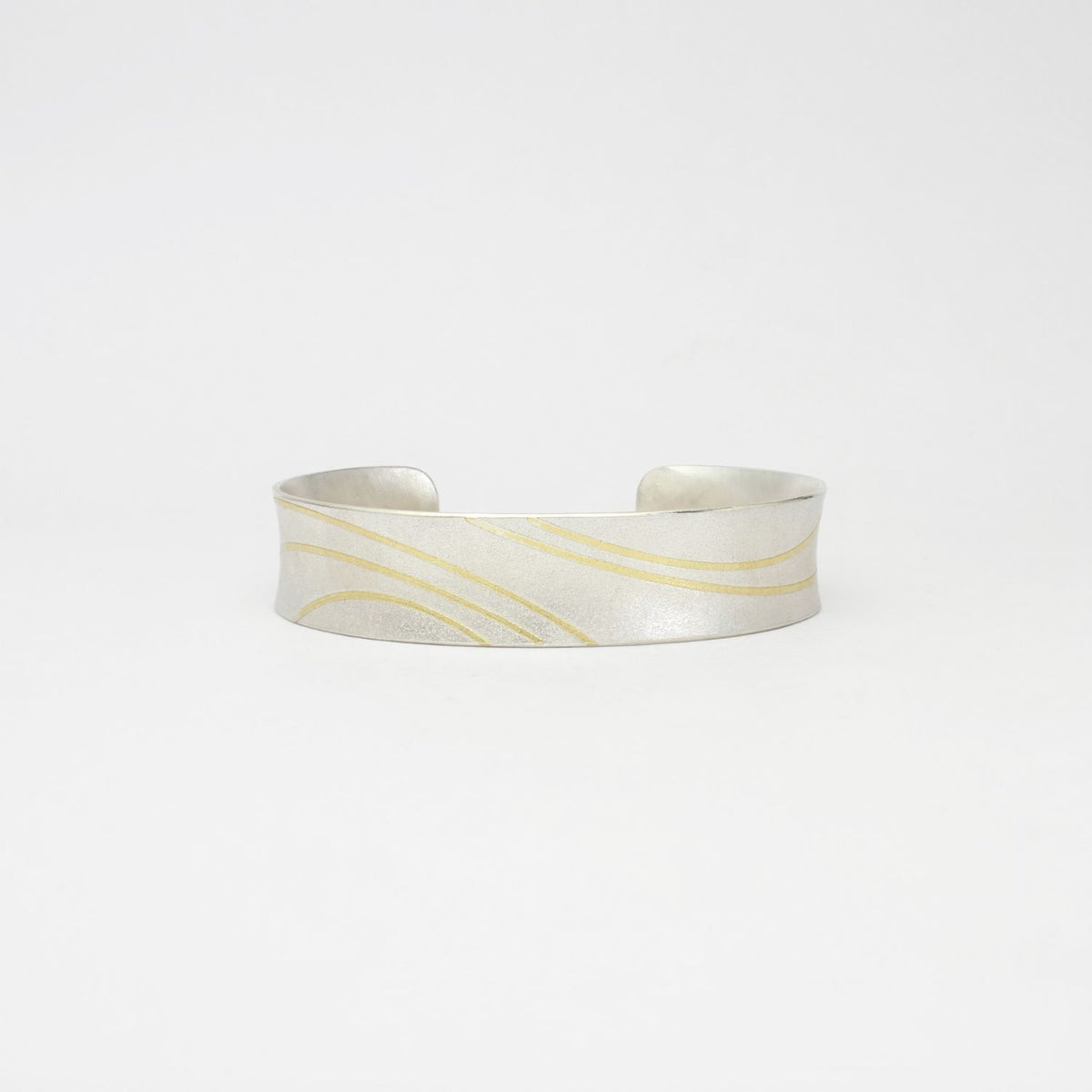 Lunar satin silver & 18ct gold cuff bangle by Hannah Souter