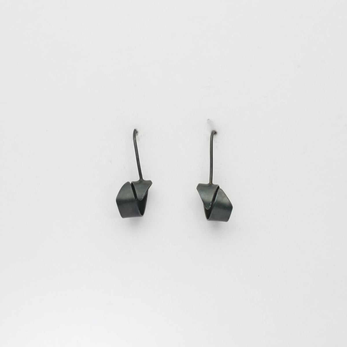 Ribbon end black silver hook earrings by Jodie Hook