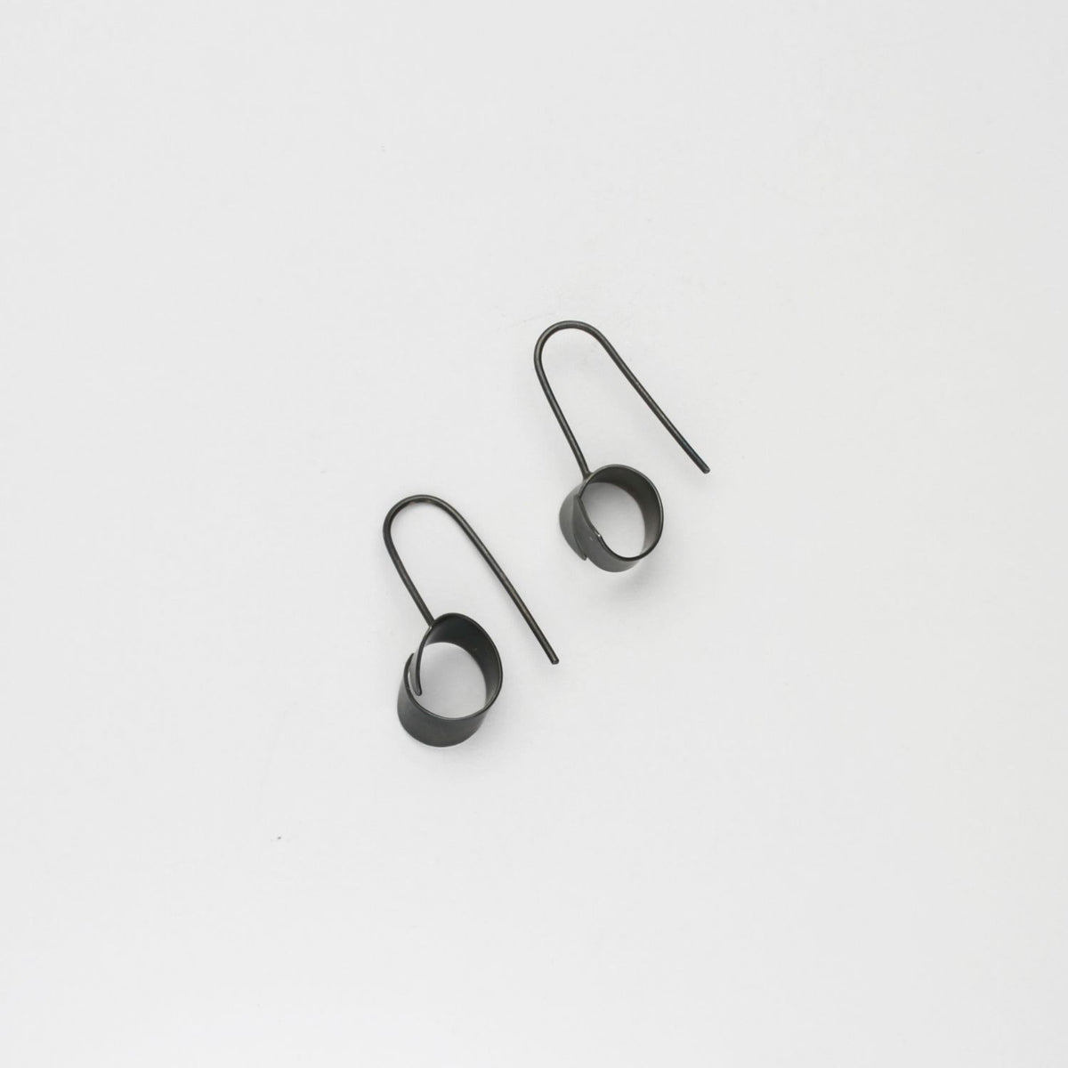 Ribbon end black silver hook earrings by Jodie Hook