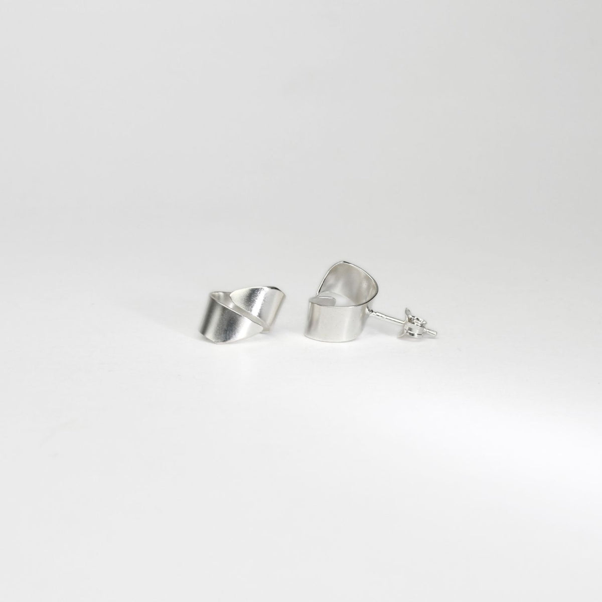 Ribbon end silver stud earrings by Jodie Hook