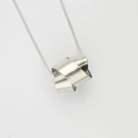Large ribbon knot pendant in silver by Jodie Hook