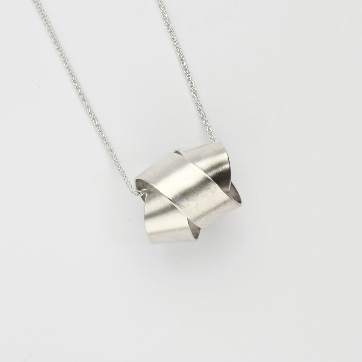 Large ribbon knot pendant in silver by Jodie Hook