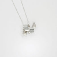 Large ribbon knot tied silver pendant by Jodie Hook