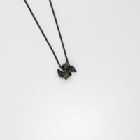 Small ribbon knot tied black silver pendant by Jodie Hook