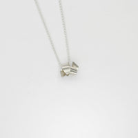 Small ribbon knot tied silver pendant by Jodie Hook