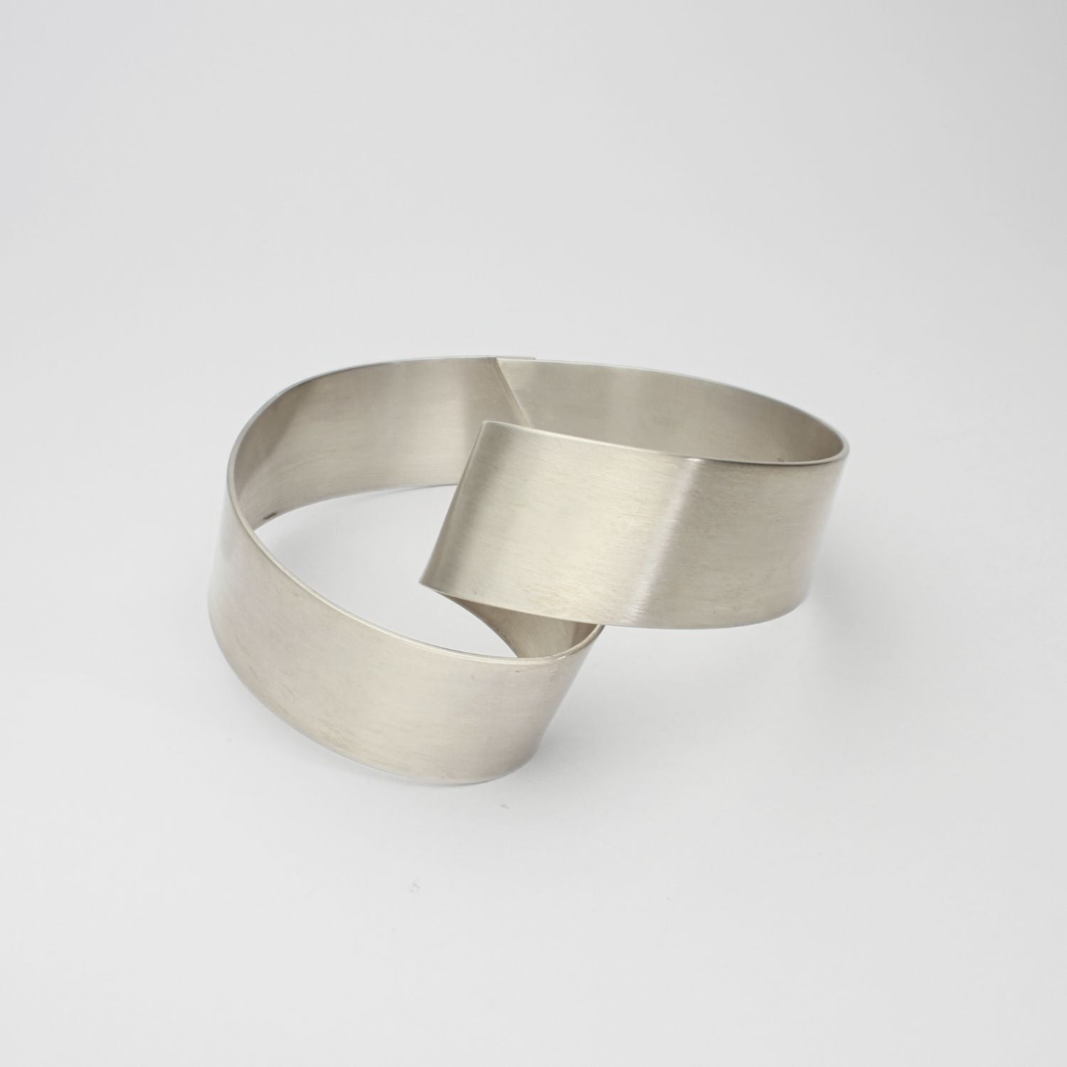 Silver ribbon loop bangle by Jodie Hook