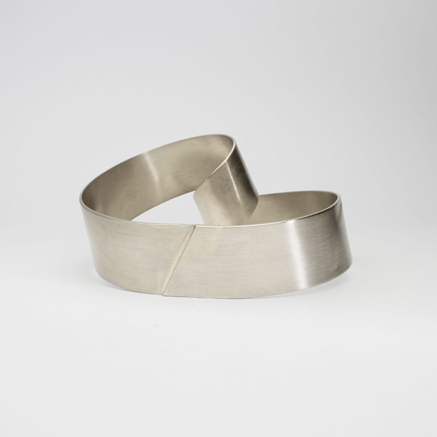 Silver ribbon loop bangle by Jodie Hook