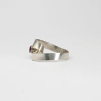 Ribbon loop ring in silver with garnet by Jodie Hook