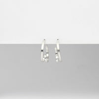 Mini ribbon loop silver hoop earrings by Jodie Hook
