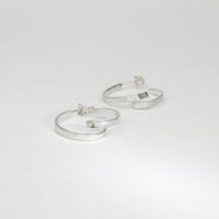 Mini ribbon loop silver hoop earrings by Jodie Hook