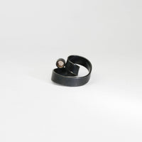 Ribbon solitaire loop black silver ring with imperial topaz by Jodie Hook