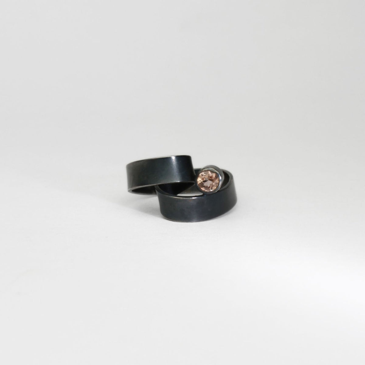 Ribbon solitaire loop black silver ring with imperial topaz by Jodie Hook