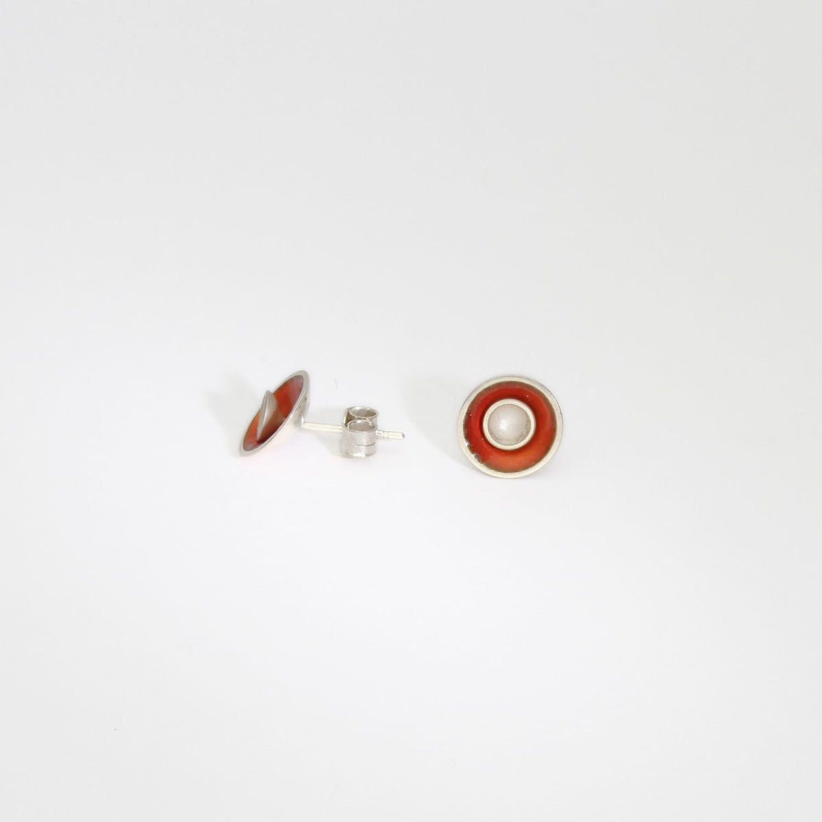Small orange target silver studs by Kokkino
