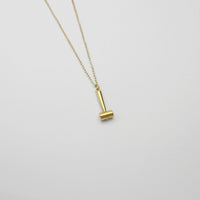 Raw hide hammer gold plated silver pendant by Katy Tromans