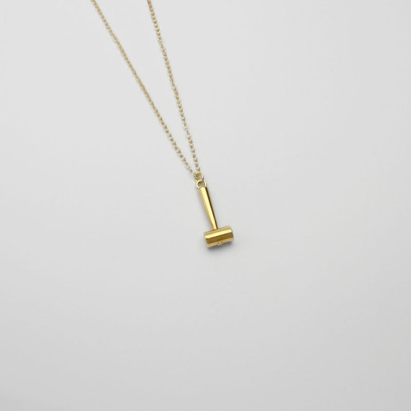 Raw hide hammer gold plated silver pendant by Katy Tromans