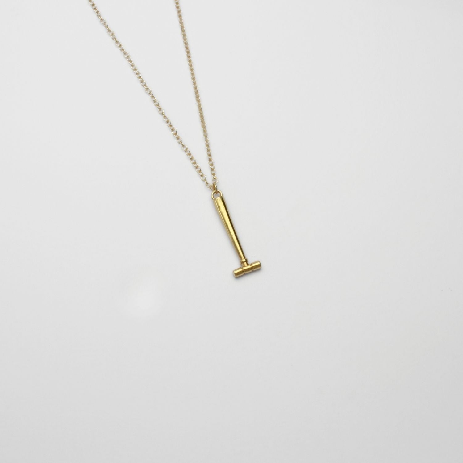 Parallel hammer gold plated silver pendant by Katy Tromans