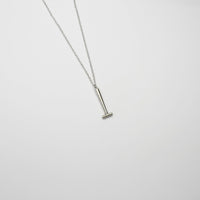 Parallel hammer silver pendant by Katy Tromans