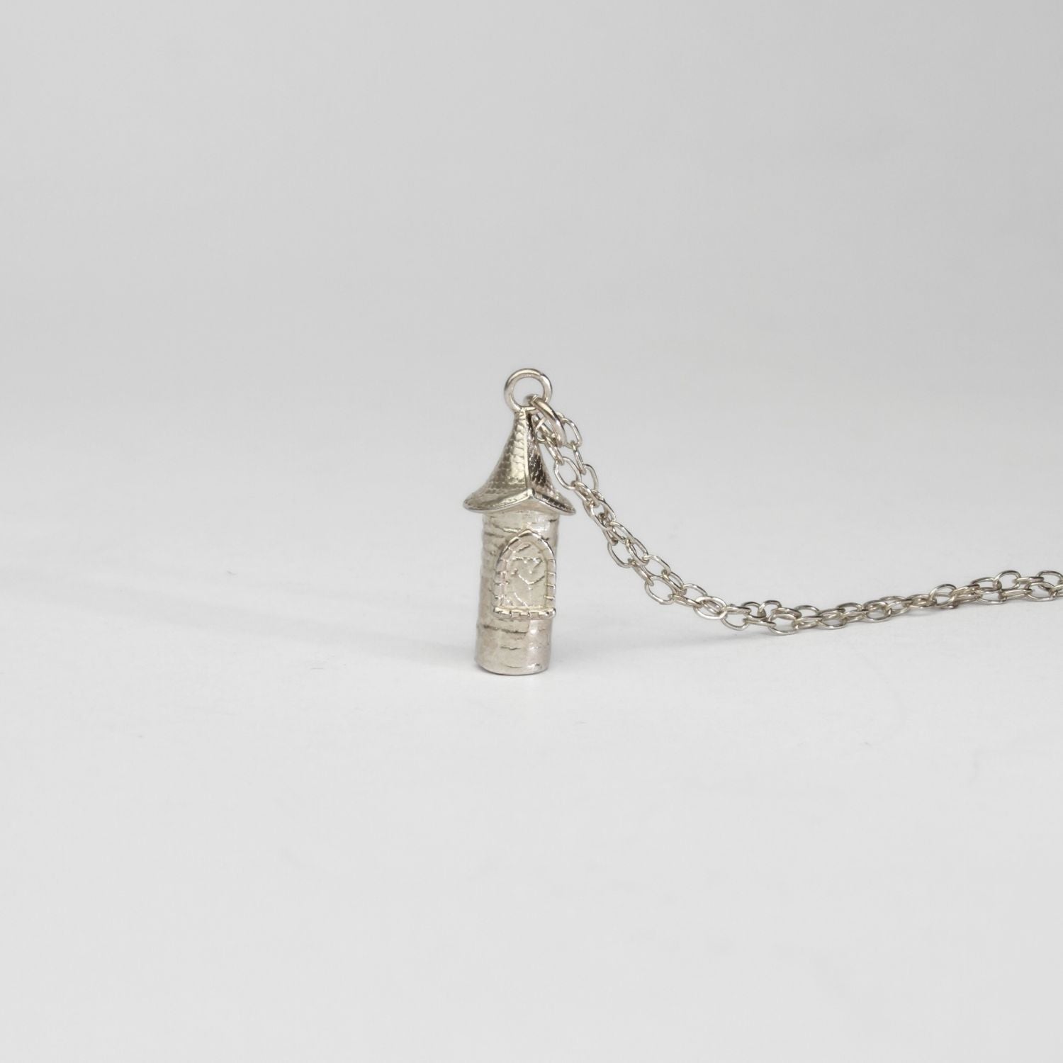Rapunzel - Round tower silver pendant by Katy Tromans