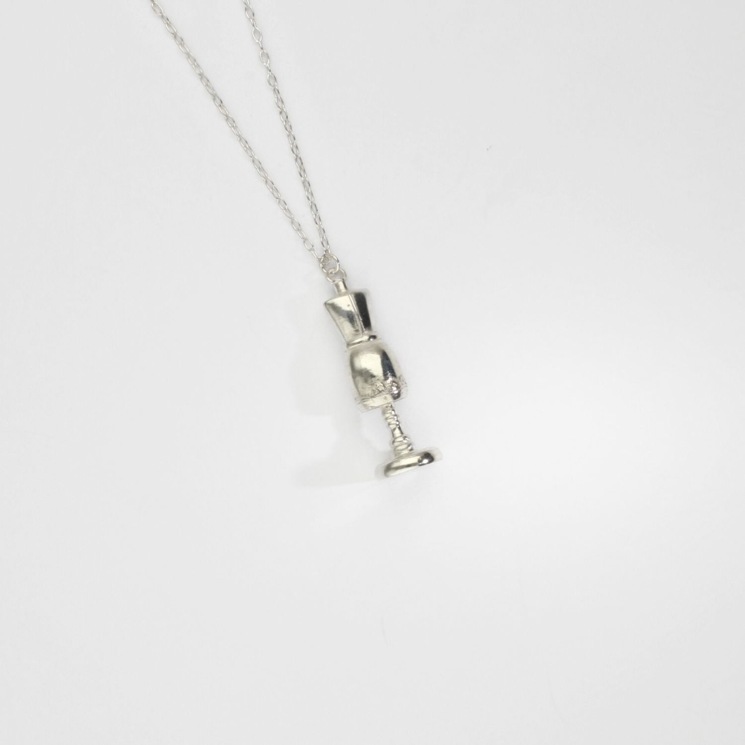 Silver bust pendant by Katy Tromans