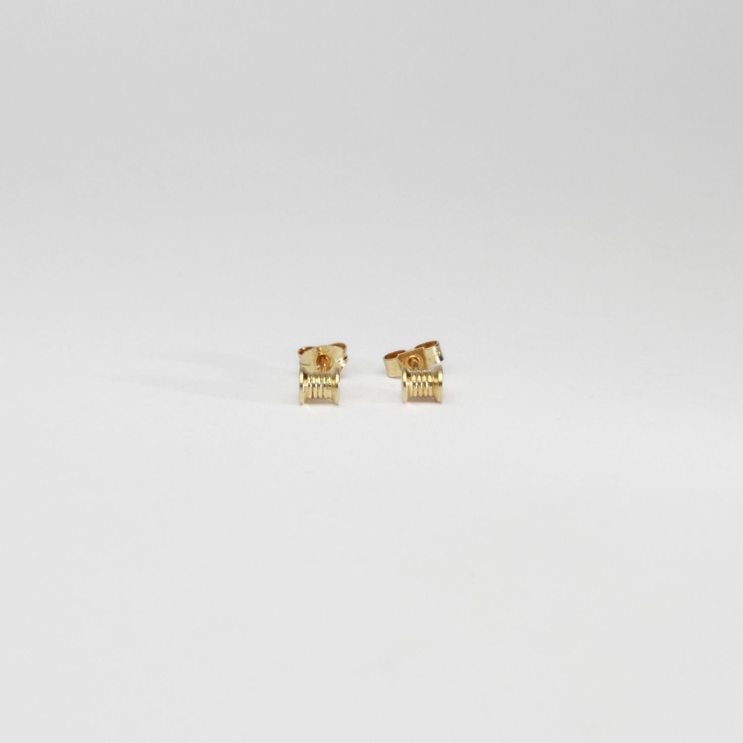 Cotton reels silver gold plated earrings by Katy Tromans