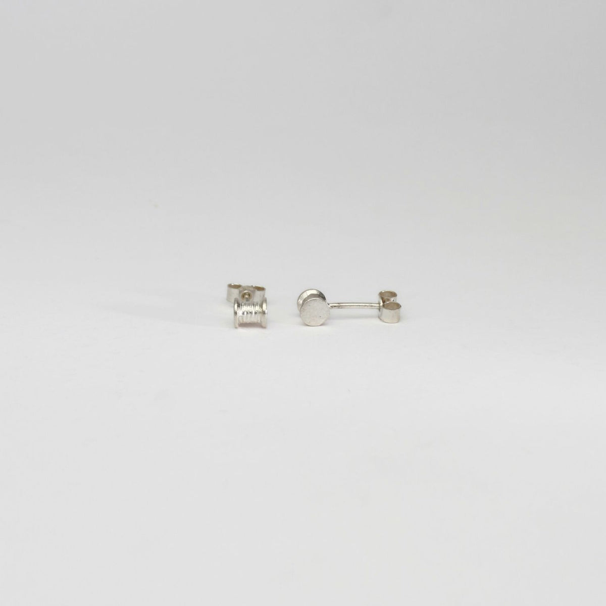 Cotton reels silver earrings by Katy Tromans