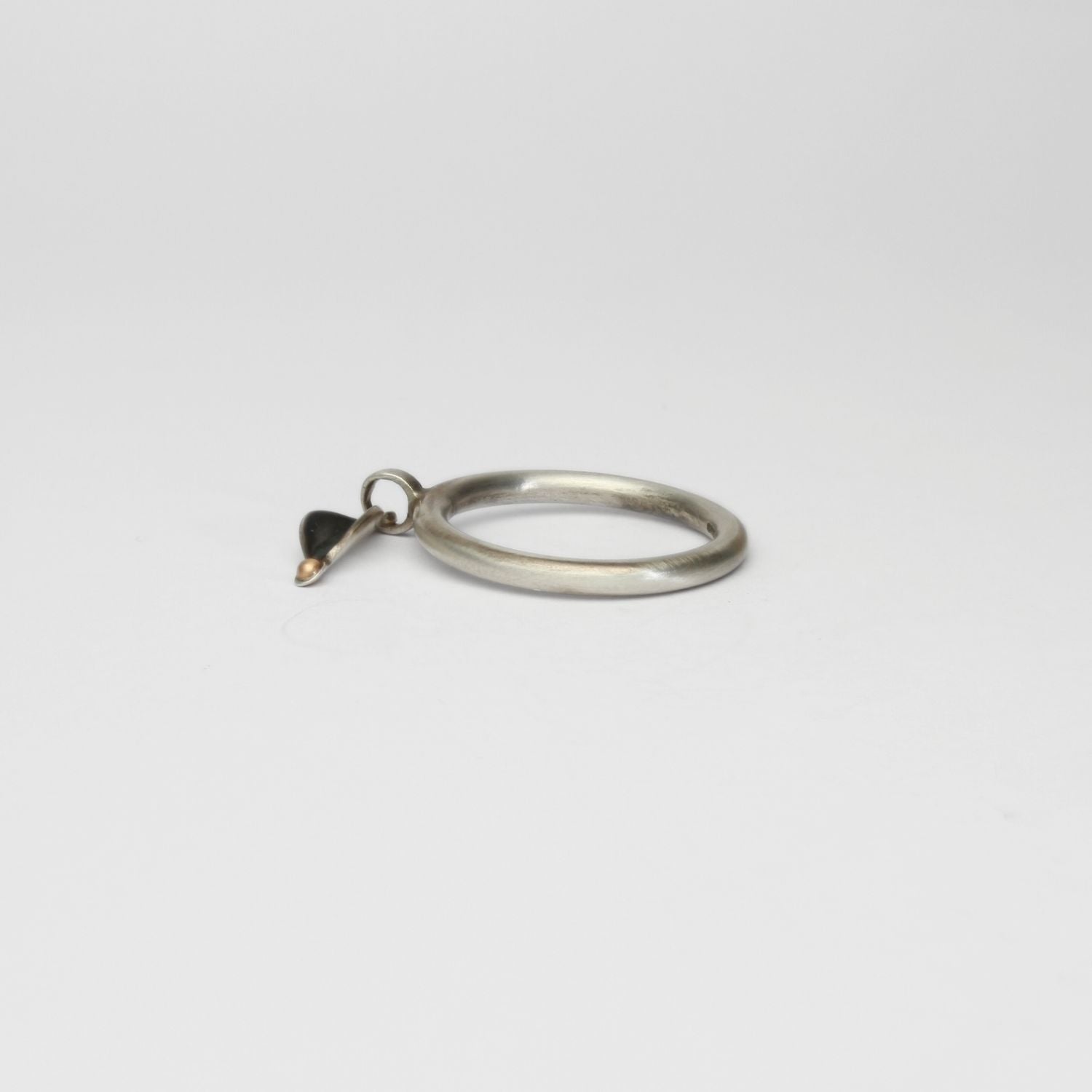 Folded leaf  black silver ring with 9ct gold by Kathryn Willis