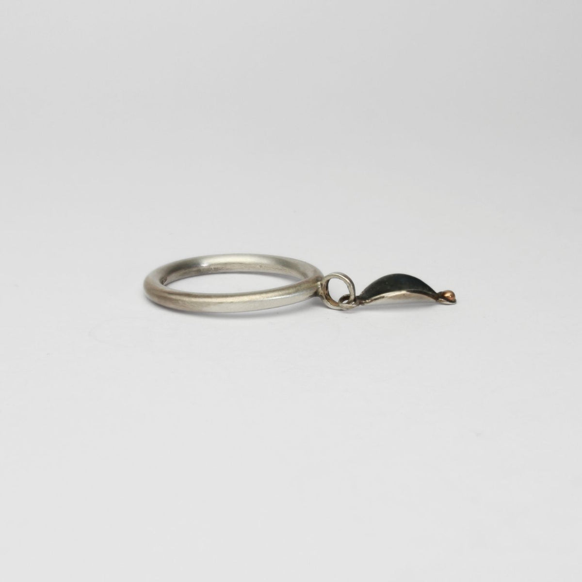 Folded leaf  black silver ring with 9ct gold by Kathryn Willis
