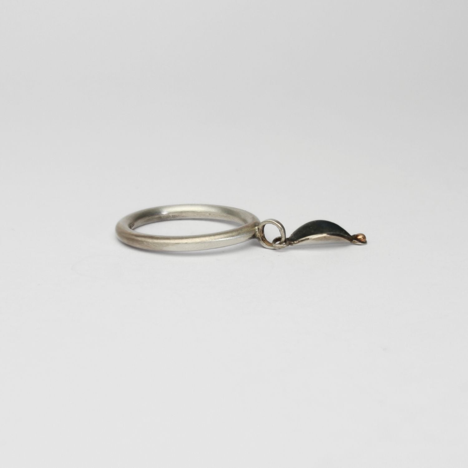 Folded leaf  black silver ring with 9ct gold by Kathryn Willis